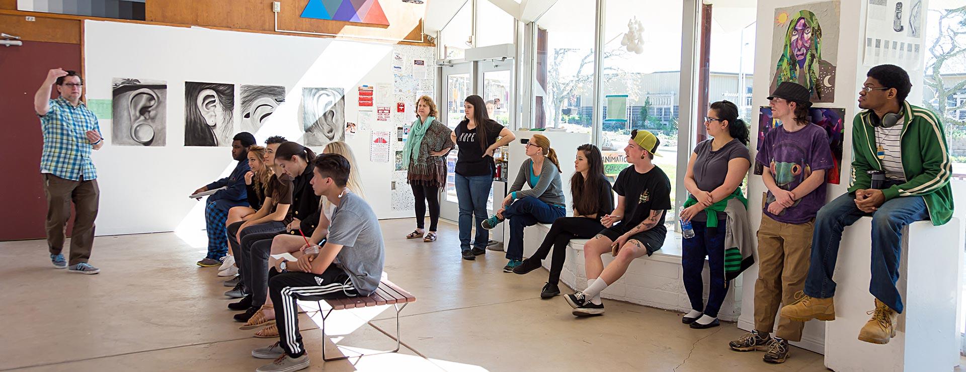 Art instructor teaching classroom in Art Building gallery hall