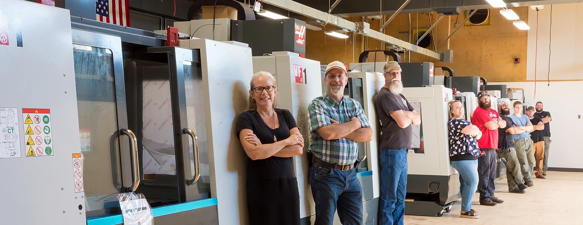 Advanced Manufacturing instructors and students inside workshop