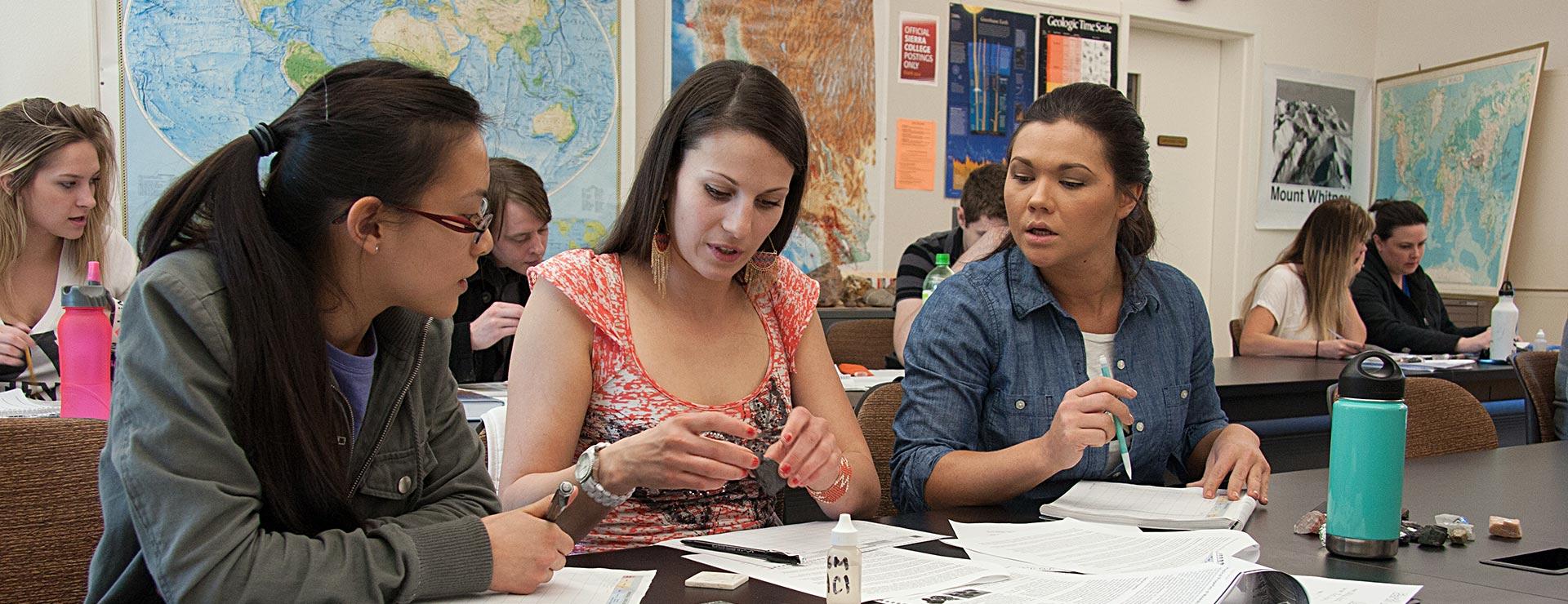 Earth Science/geology students discussing class project in a classroom