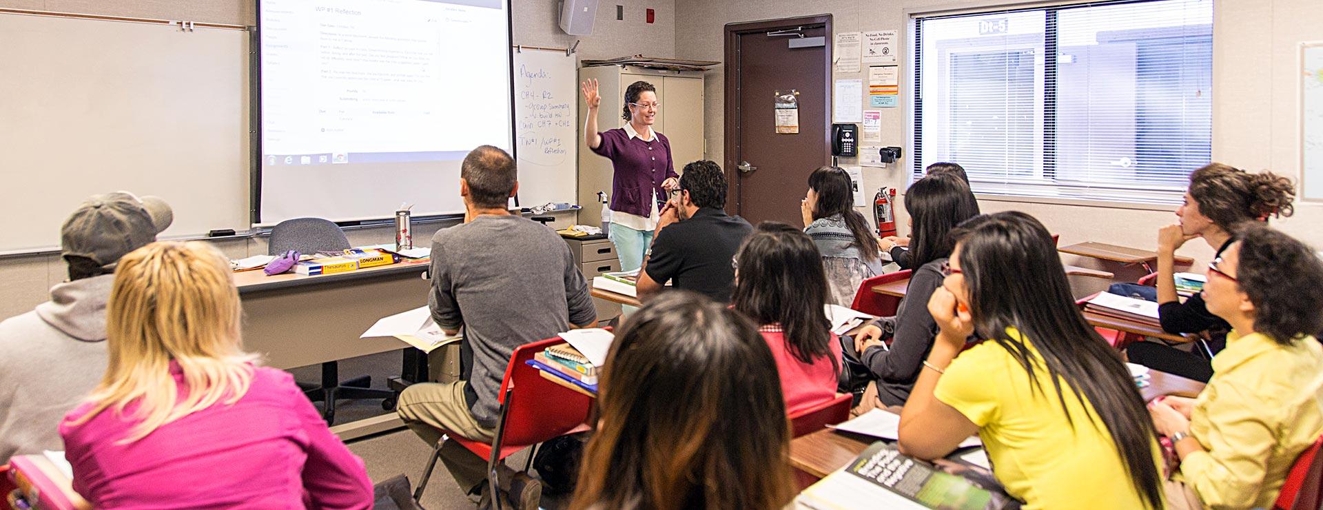 English instructor providing details about writing assignment