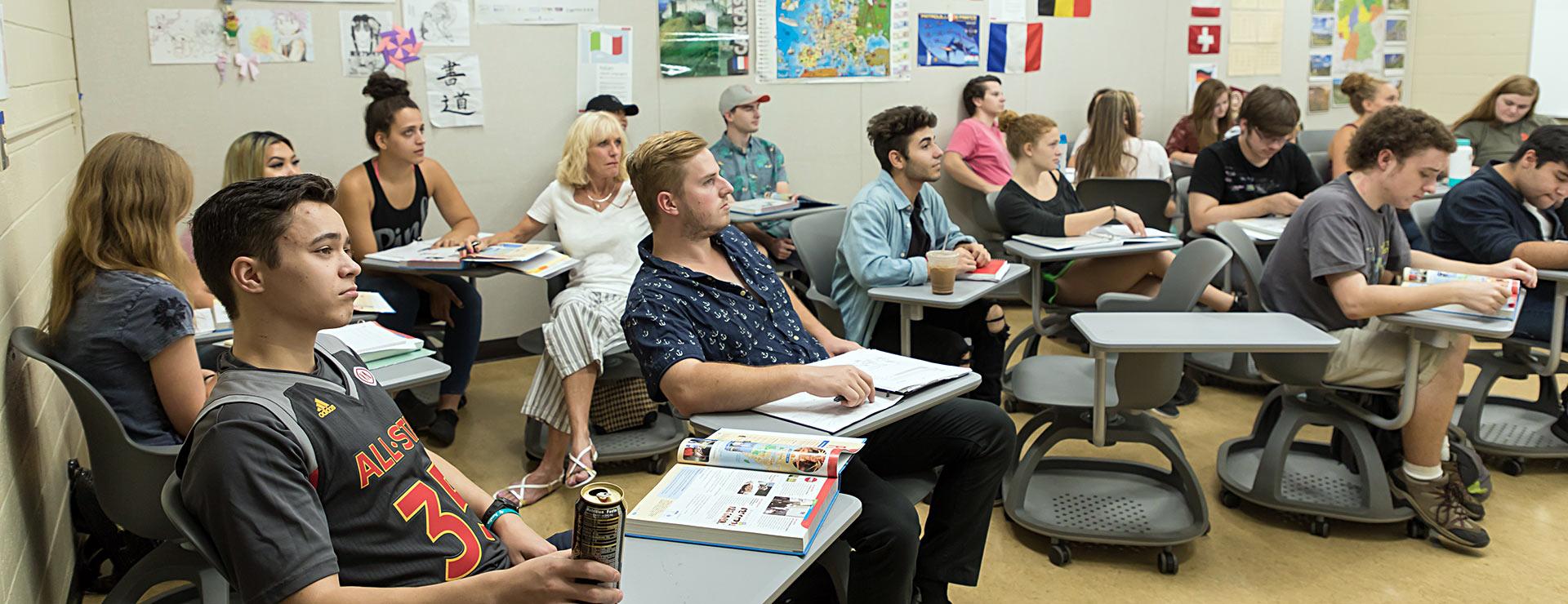 Classroom of World Language students looking toward front of classroom where instructor is teachin