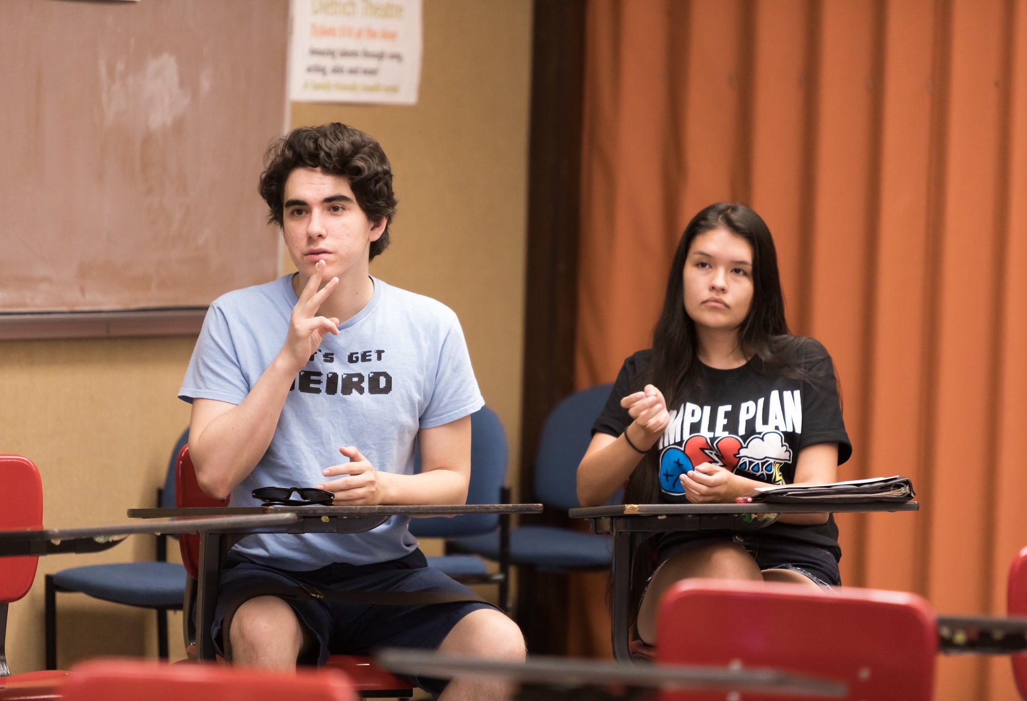 Students signing in class.