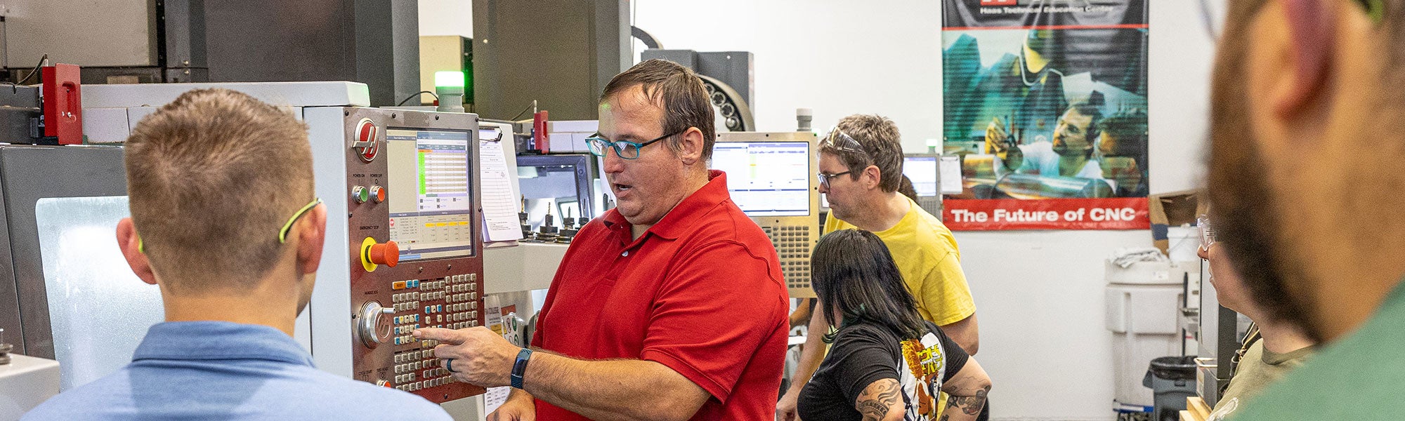 Instructor showing how to use Haas industrial computer