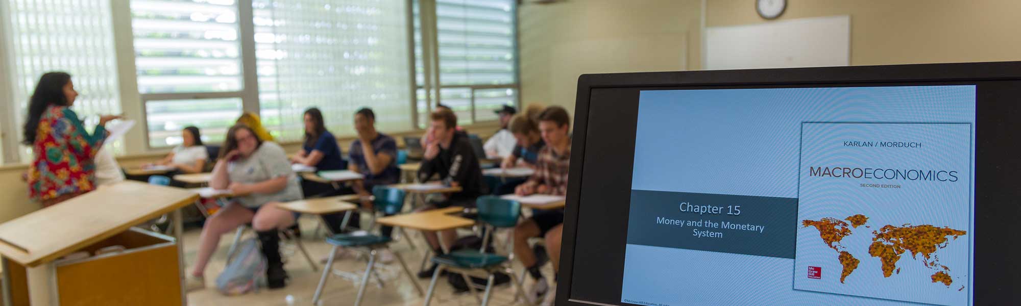 Instructor explaining macroeconomics