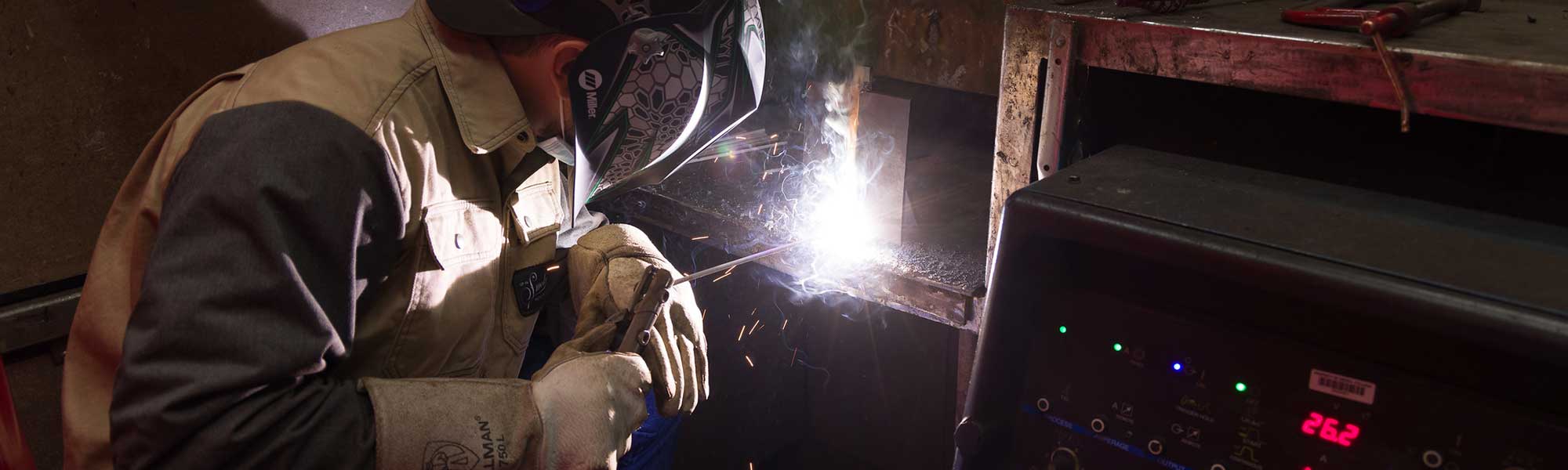 Student wears protective gear while welding