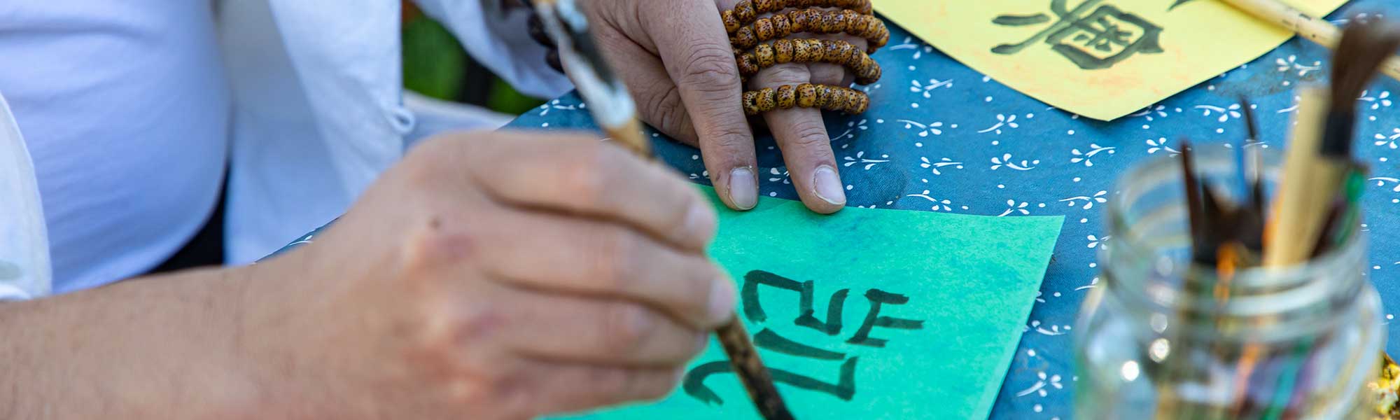 Person practices Japanese characters
