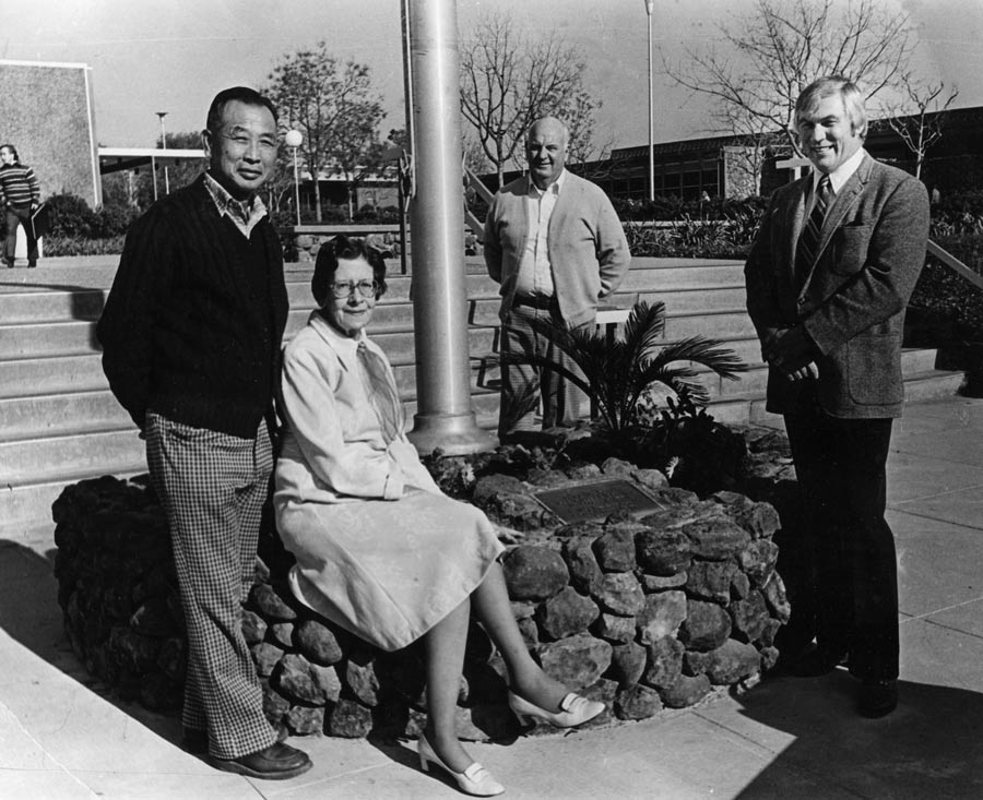 Ted Kitada and Gerald Angove standing by the flag pole on the Rocklin campus