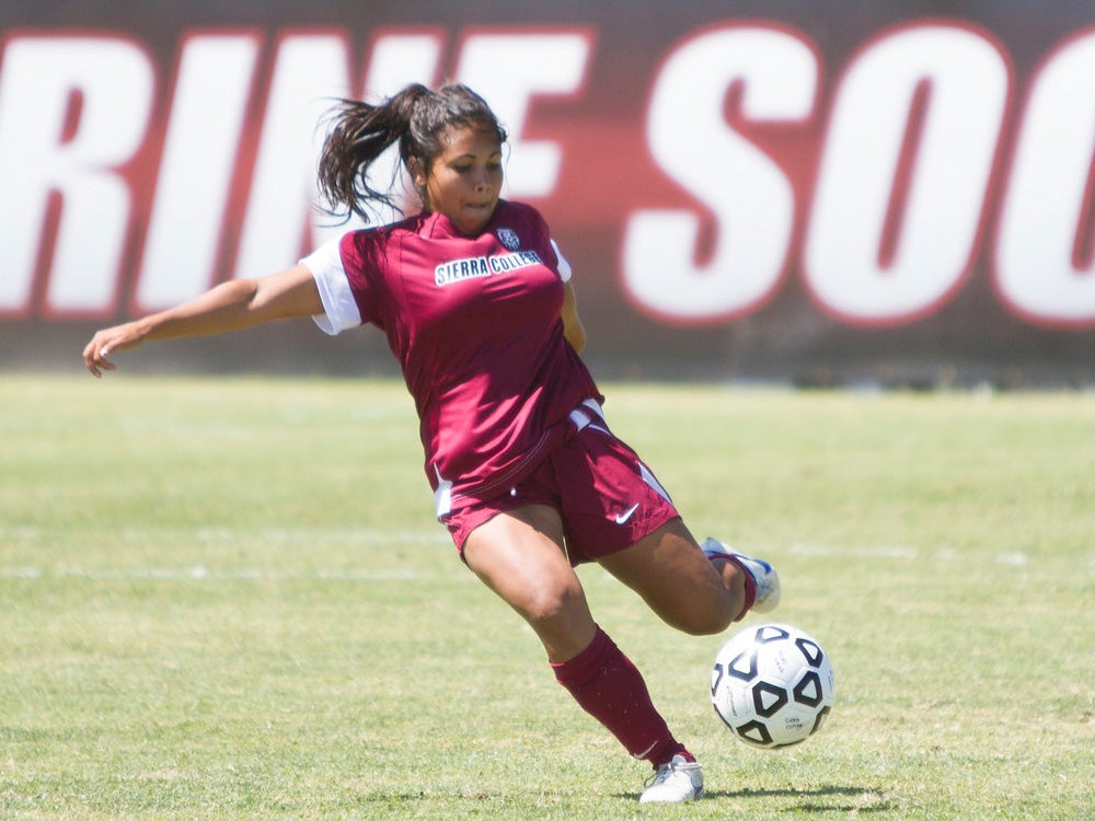 A girl playing soccer