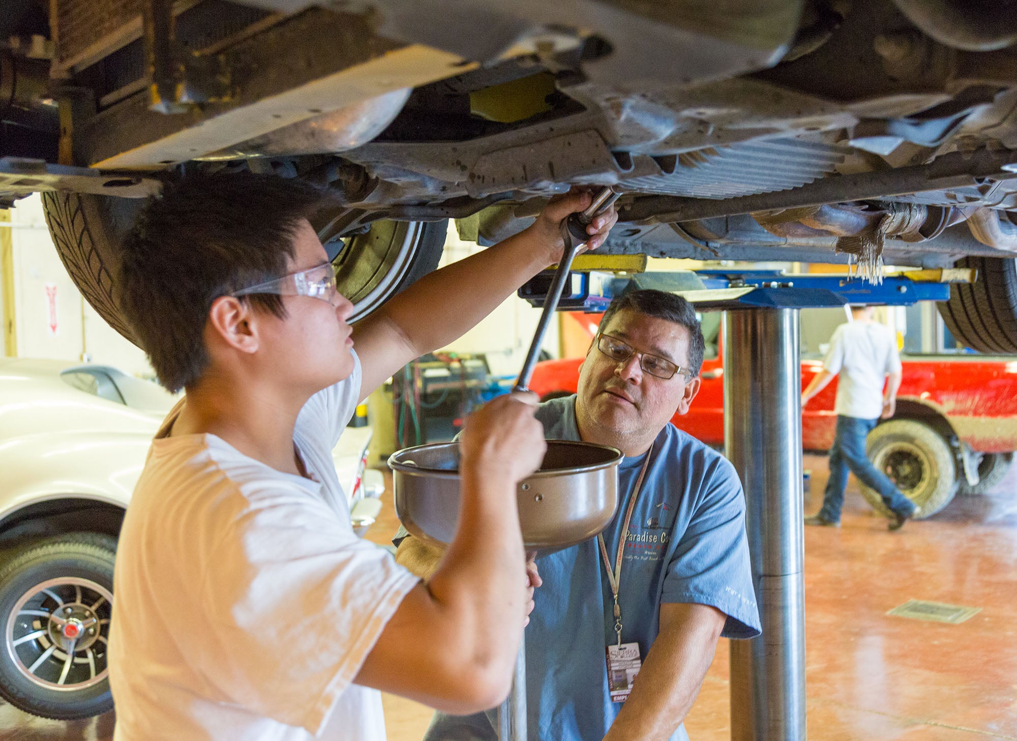 Automotive Technology student working on a car with supervision at Sierra College