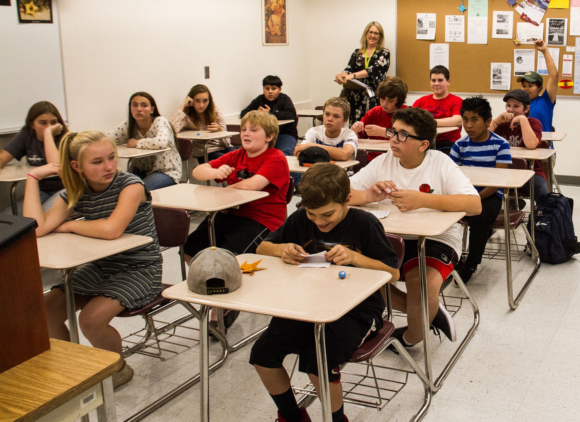 Elementary school teacher with classroom filled with students