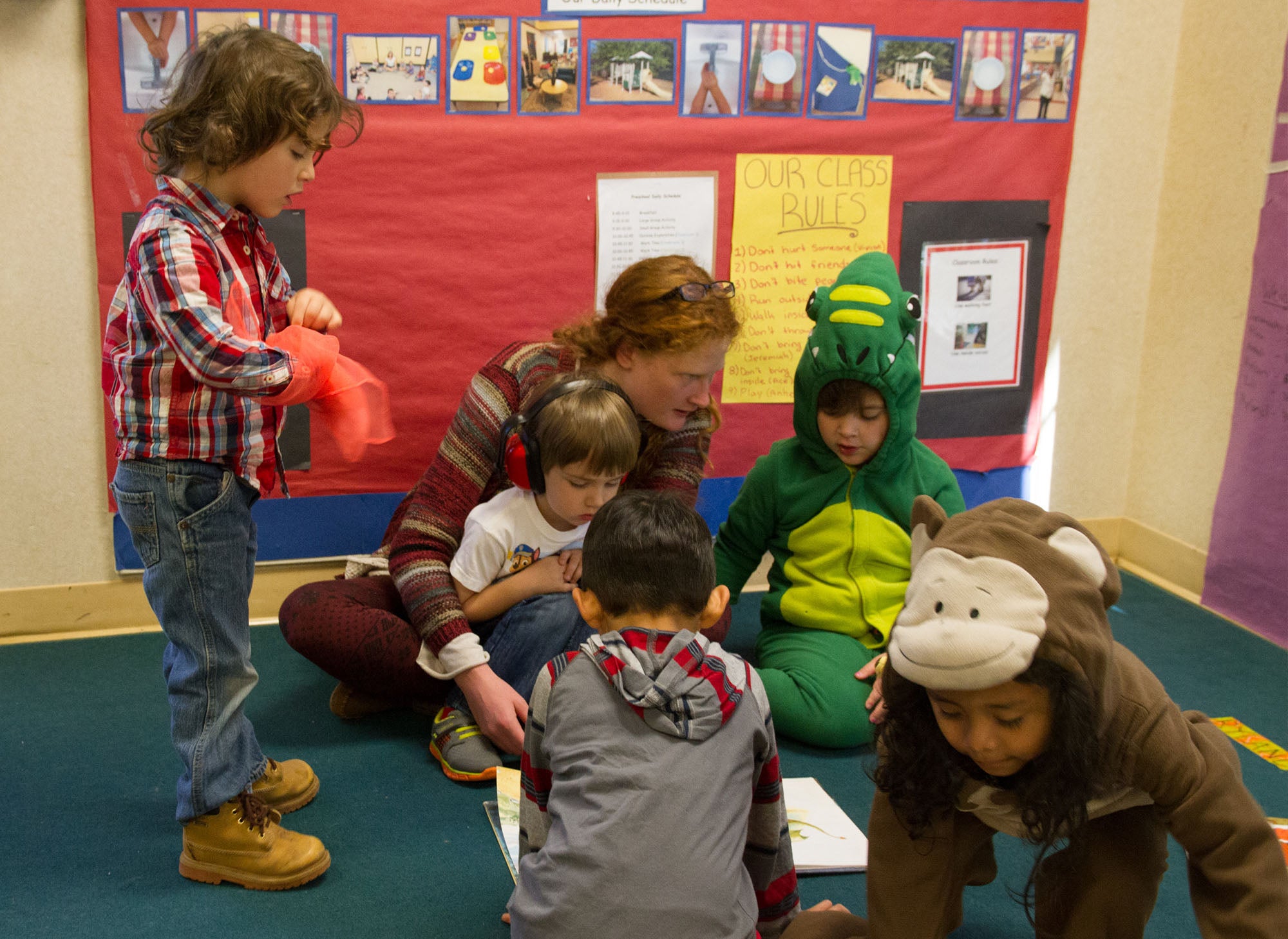 Preschool teacher with five young children