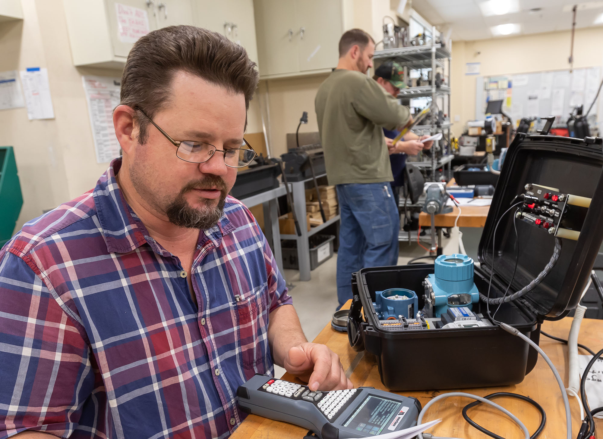 Mechatronics student working on project with specialized instrumentation at Sierra College