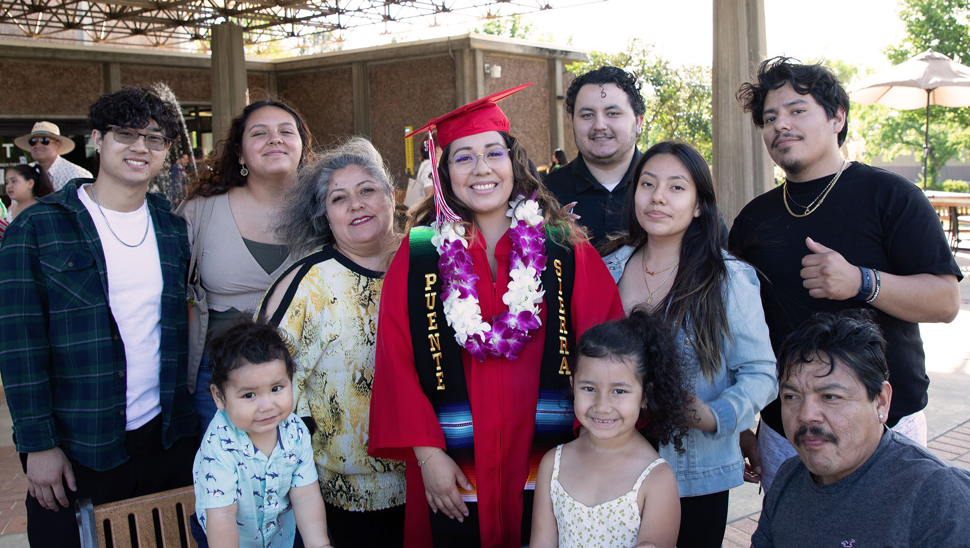 Large family supporting and celebrating their new graduate from Sierra College