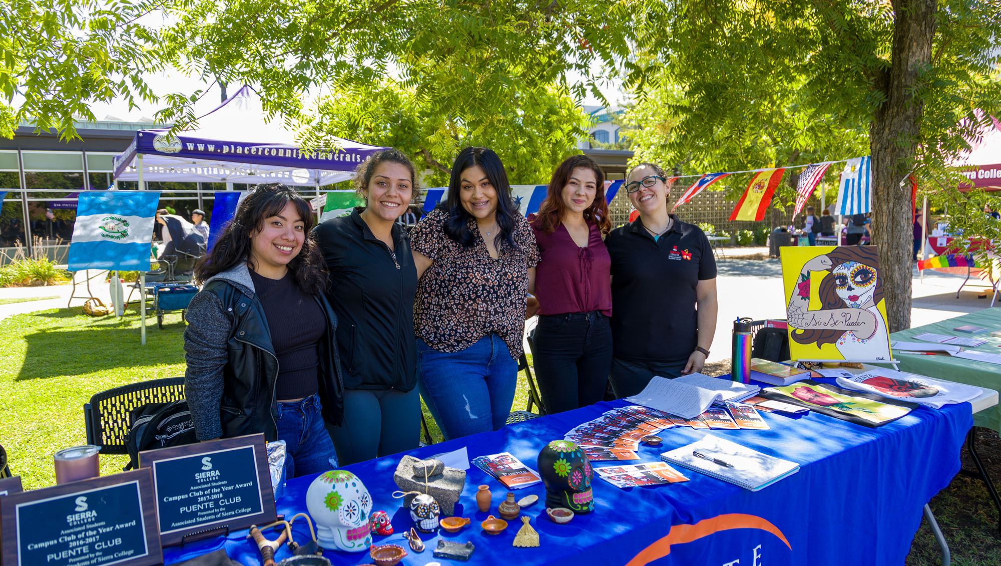 Students at the Puente booth during Wolverine Week at Sierra College