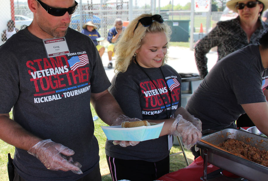 Sarah Sanders serving food for Veterans Stand Together Event