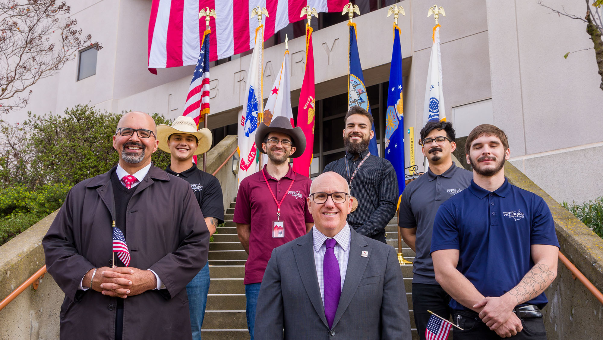Six staff members from the Veterans Success Center with the Sierra College President