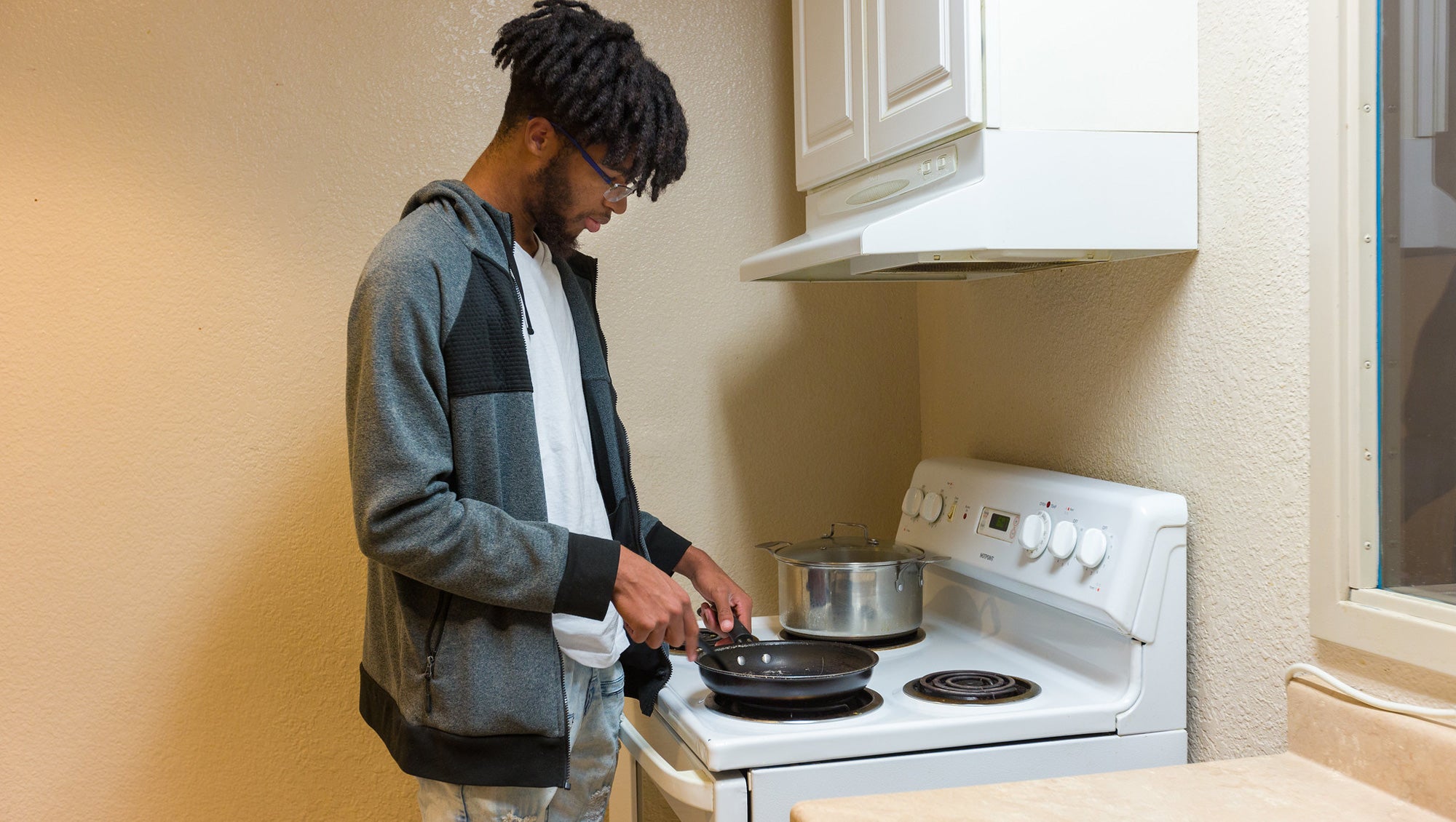 Student in the kitchen cooking food