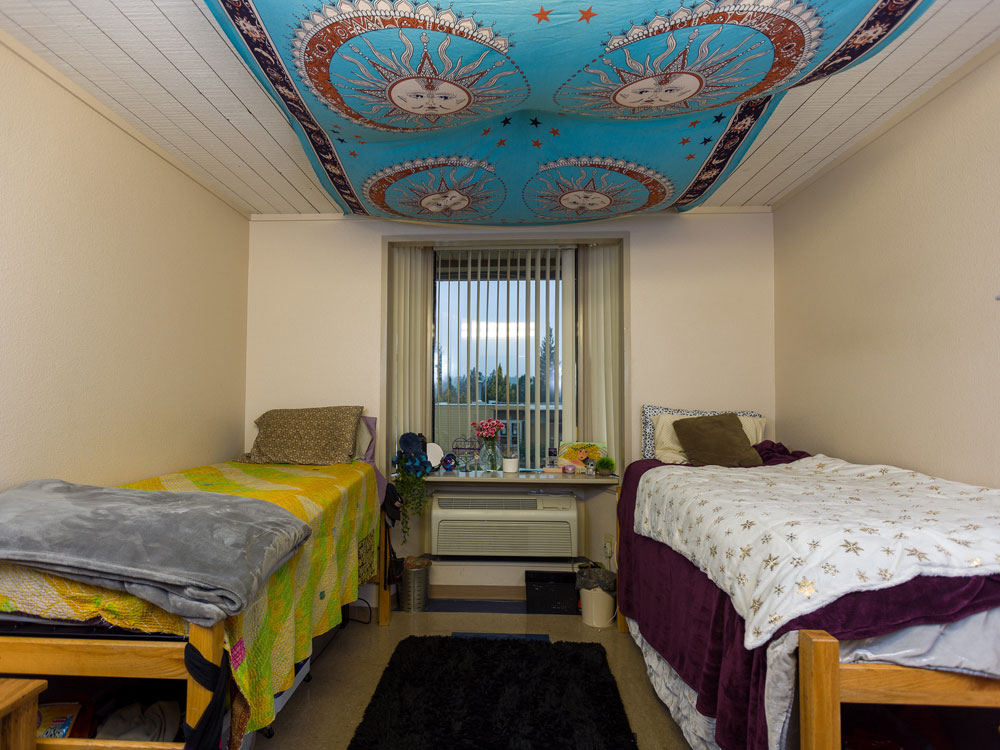 Sierra College student residence room with two beds and a window