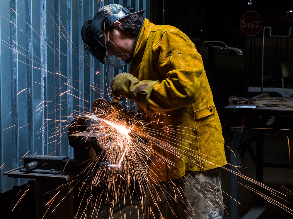 Welder in safety gear working in the Sierra Rocklin campus welding facility