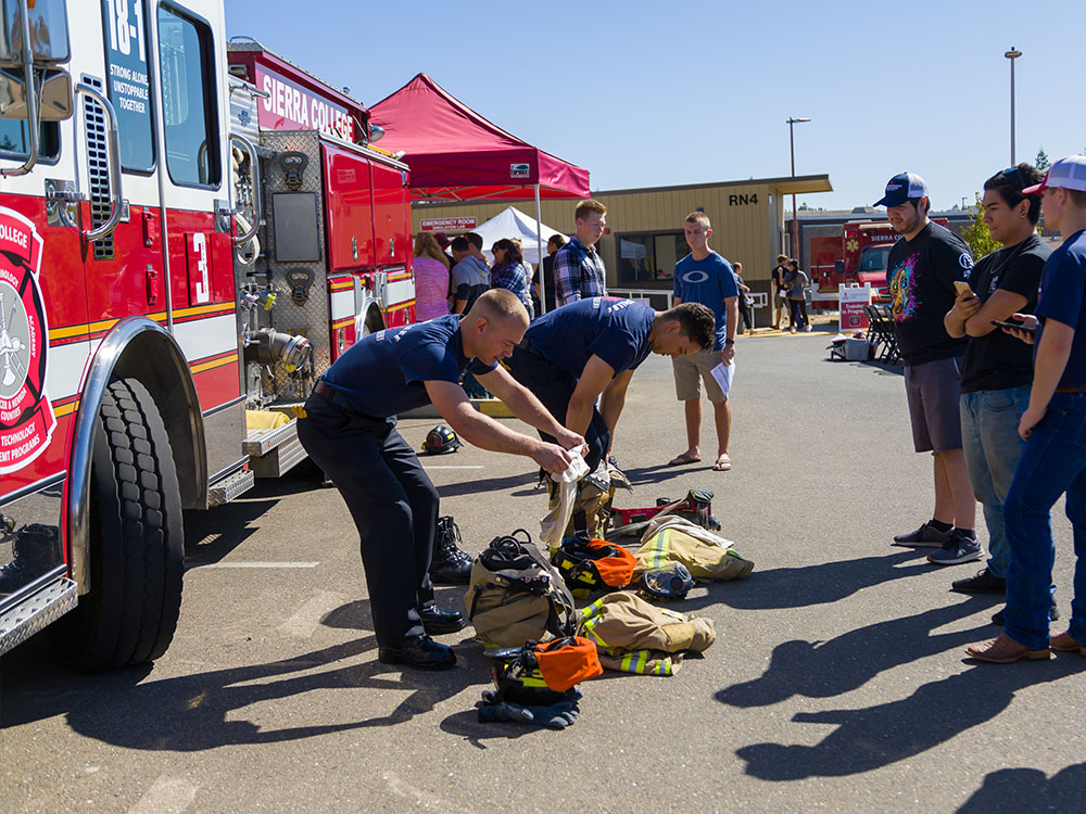 Sierra Fire Technology students demonstrating safety gear to public
