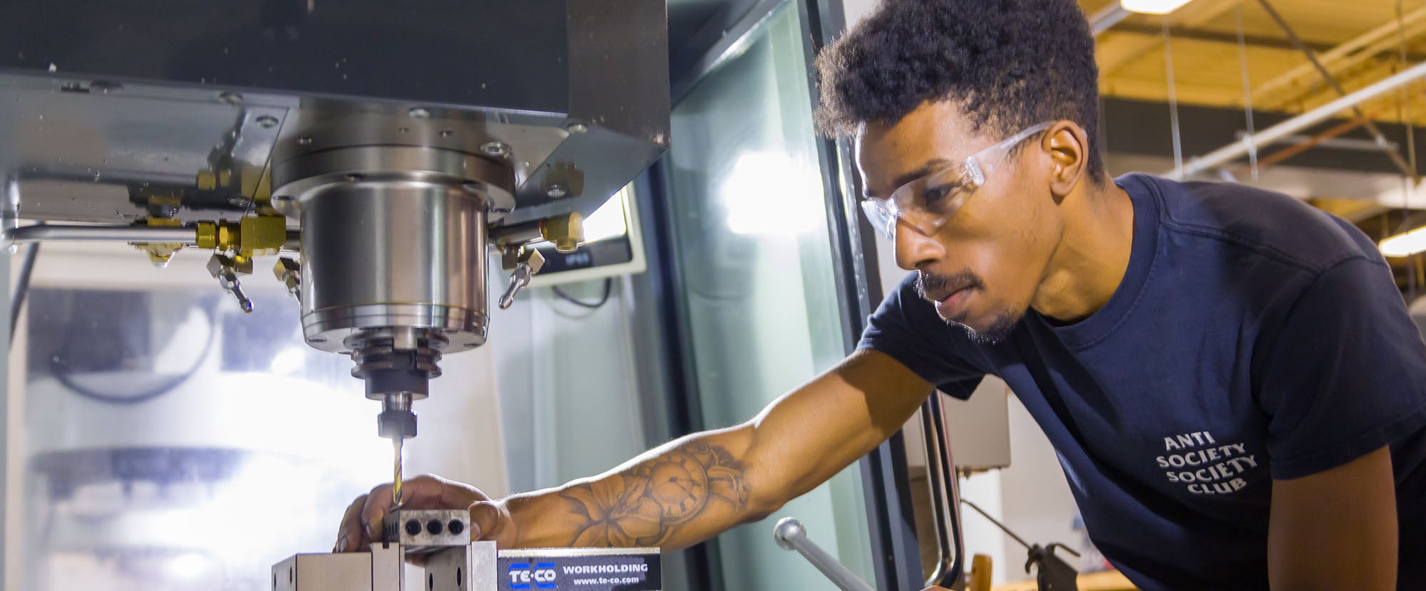 Black male student using equipment in Advanced Manufacturing class at Sierra