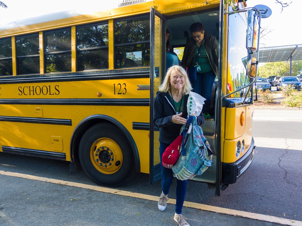 Students are getting off the school bus