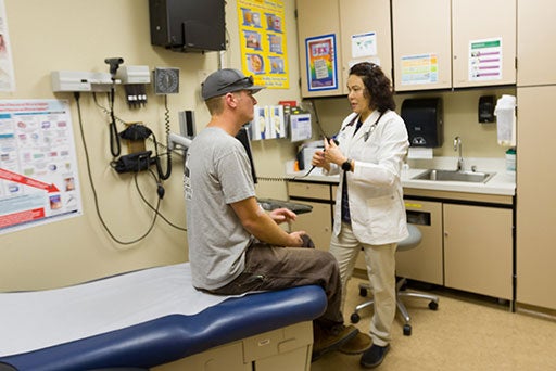 Male patient receiving care from a Health Services nurse on the Rocklin Campus.