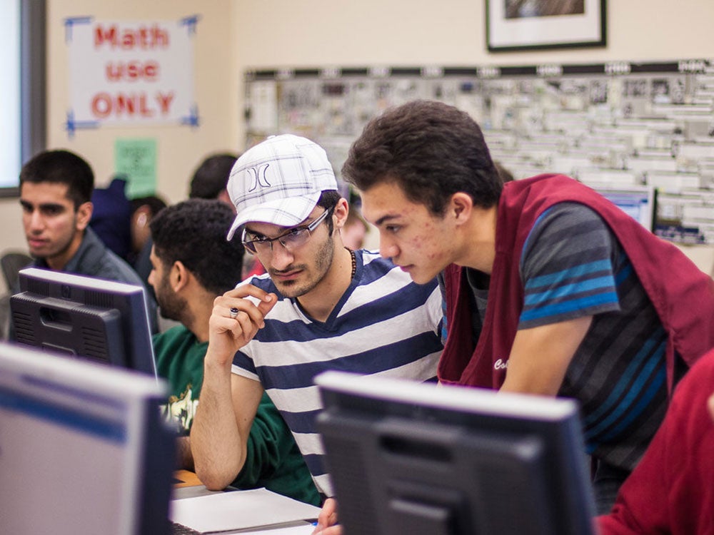Math Lab peer tutor helps another student