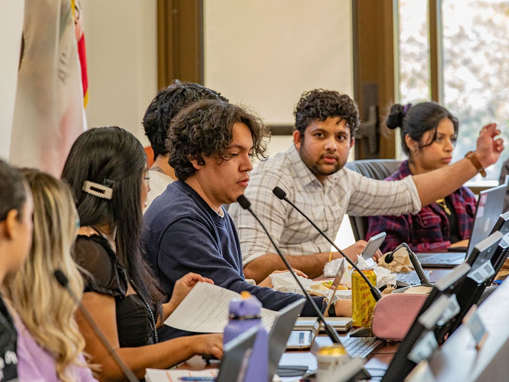 ASSC officers discussing issues at ASSC meeting in the board room on the Rocklin campus