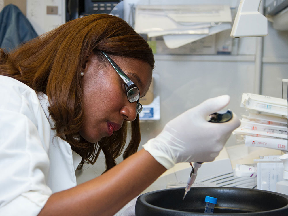 Female African American scientist working in lab