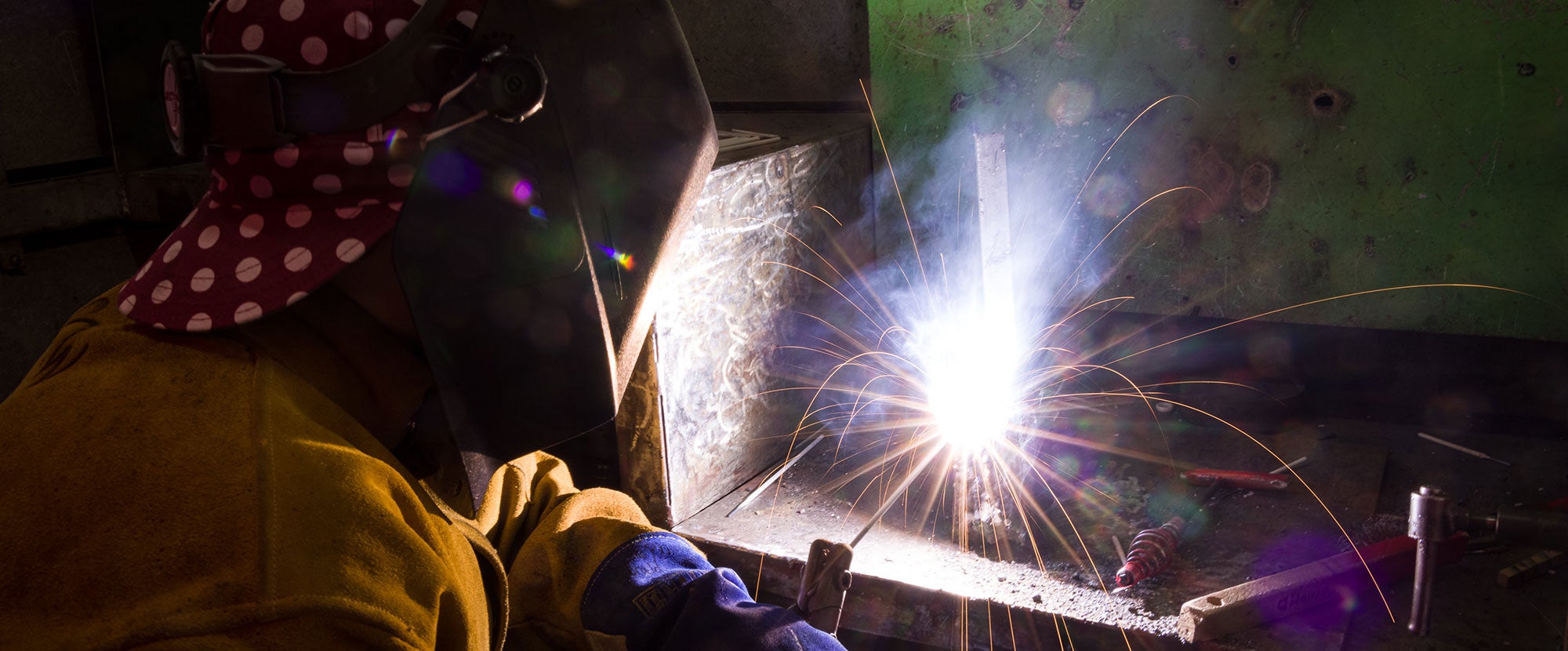Student using welding equipment