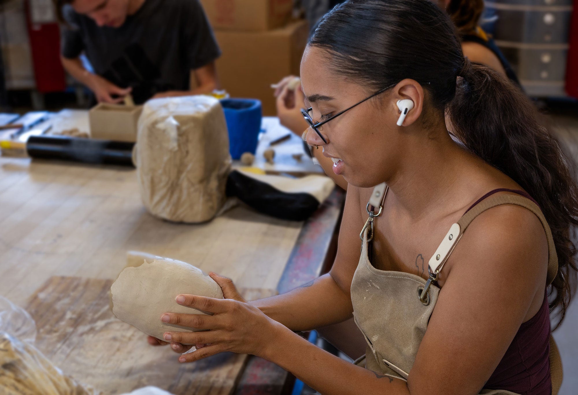 Woman creating art in class.