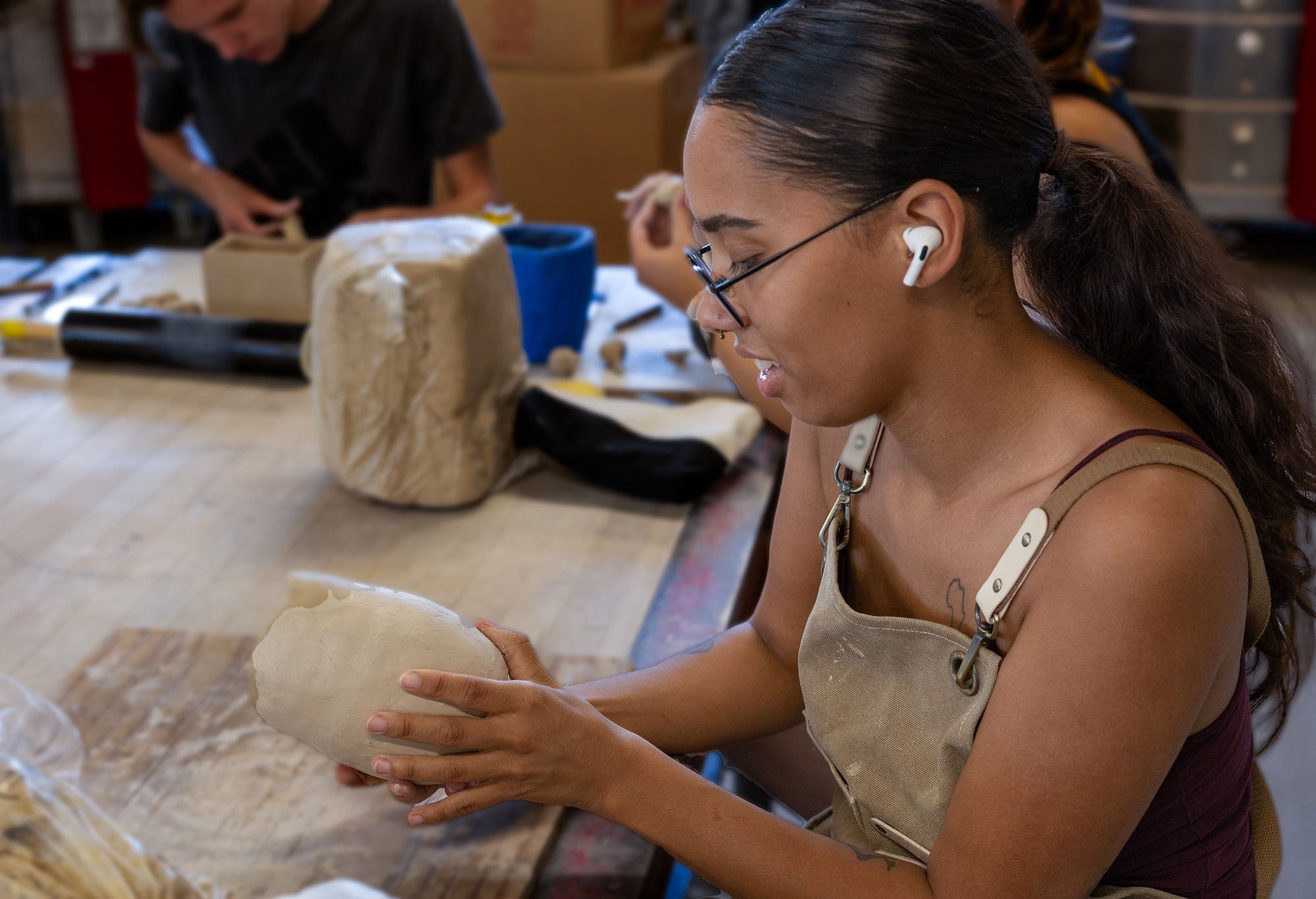 Woman creating art in class.