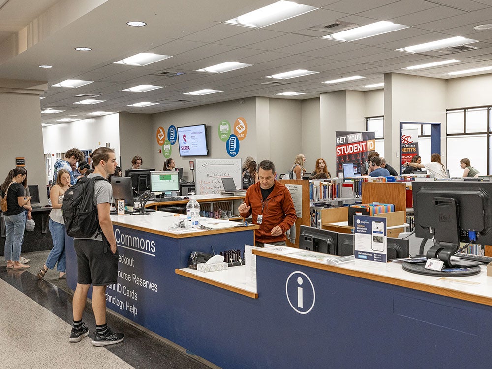 Students studying and using computers in library on Rocklin campus