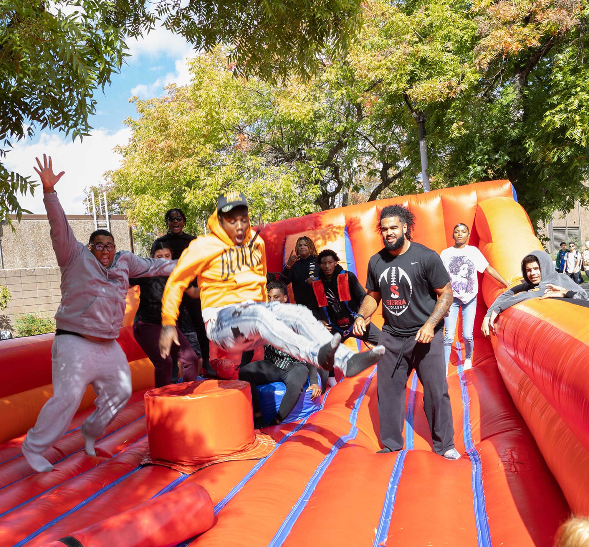 Students attending Residence Hall orientation get to know one another playing games on giant blow-up toys.