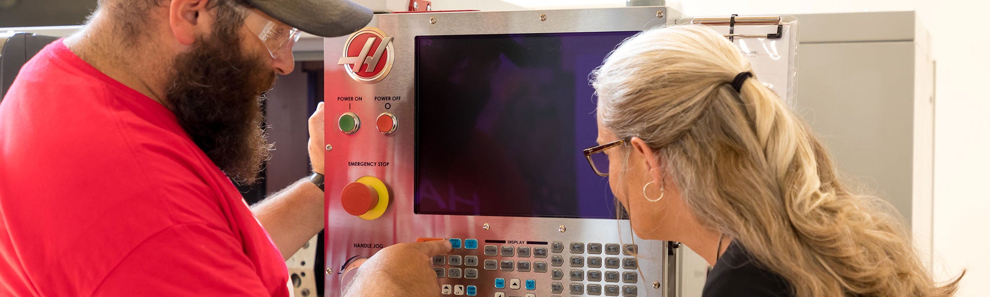 Instructor showing how to use Haas industrial computer