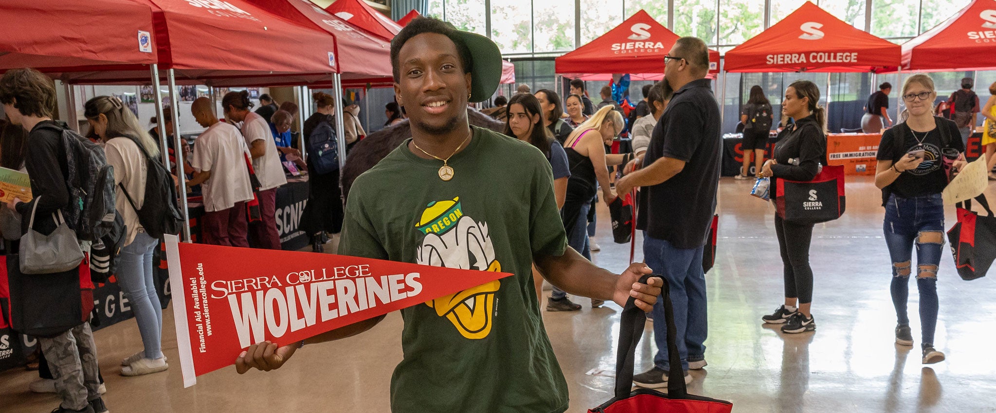 Student shows off schwag from welcome event