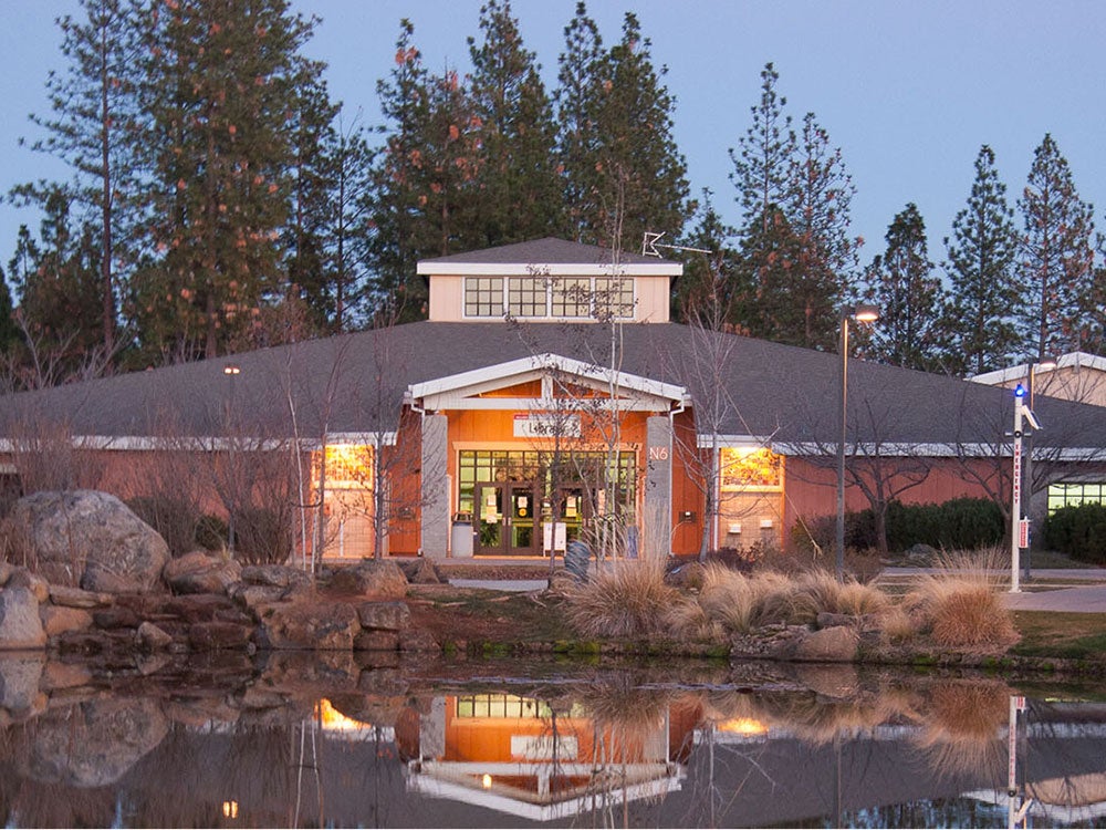 Sierra College NCC Campus building with white blooming trees.