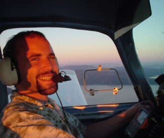 Joshua Cohen piloting airplane