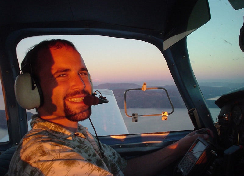 Joshua Cohen piloting airplane