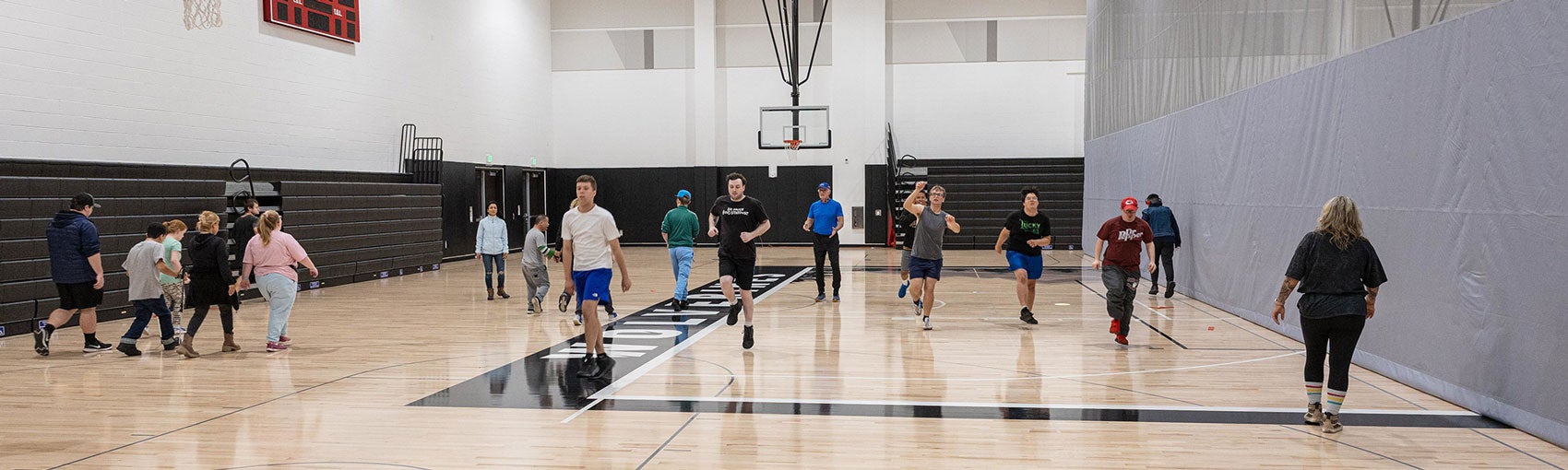 Class of students exercising in gym together
