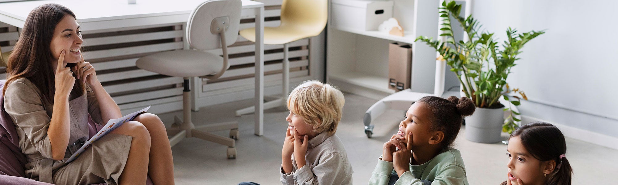 Registered Behavioral Technician working with three children in therapy