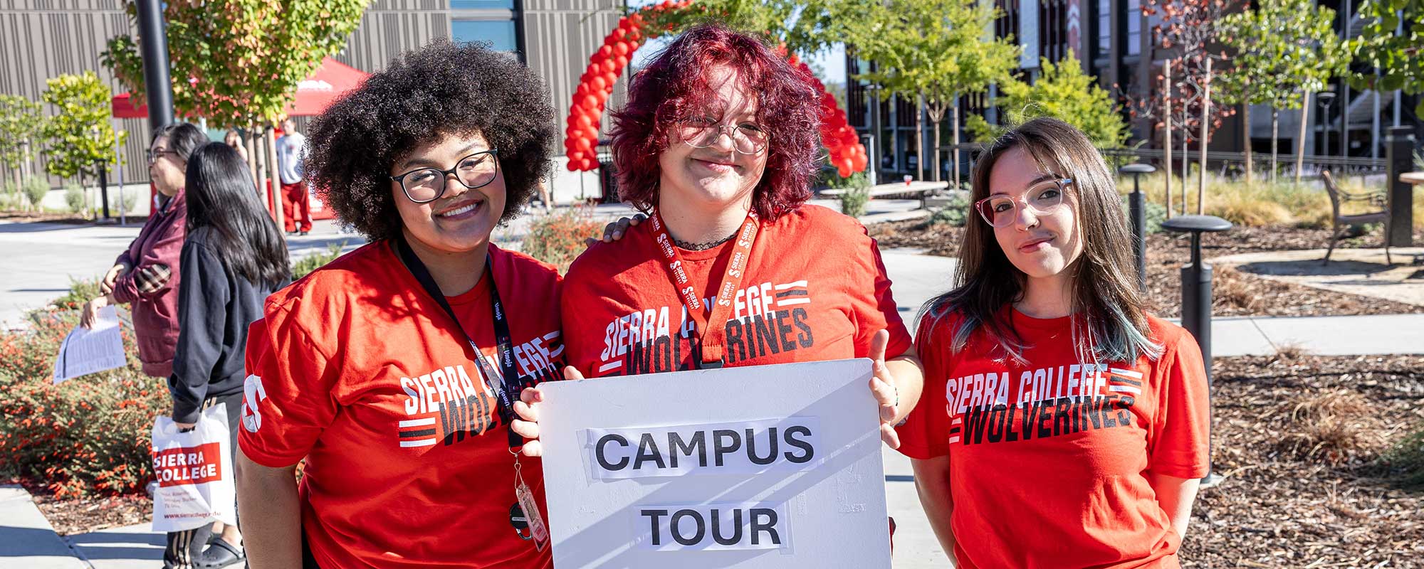 Three students promoting Rocklin campus tours