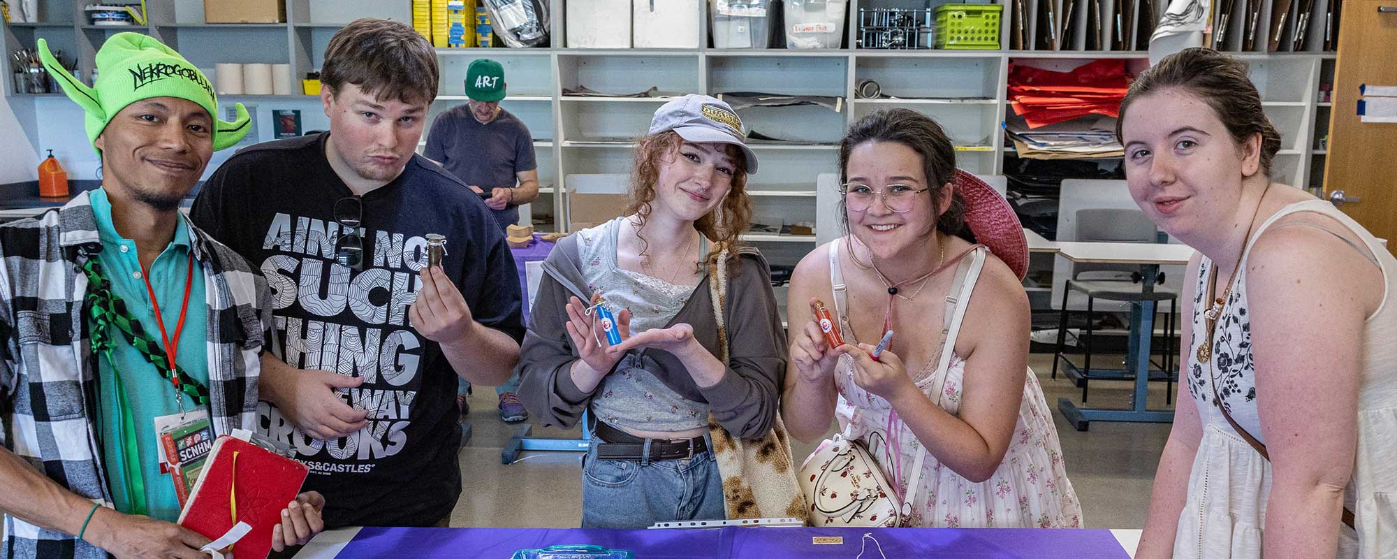Five students working on craft project at VAPA 2025 event