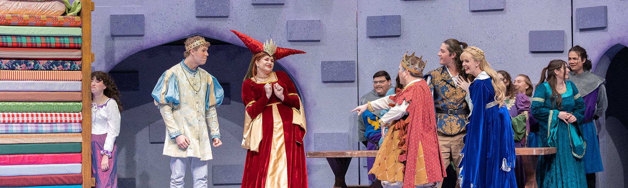 Actors on set of Once Upon a Mattress theatre production in Dietrich Theatre