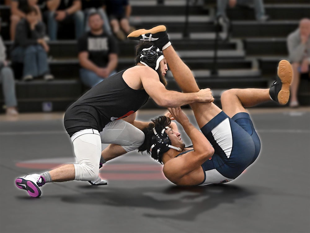 Two students competing in wrestling match