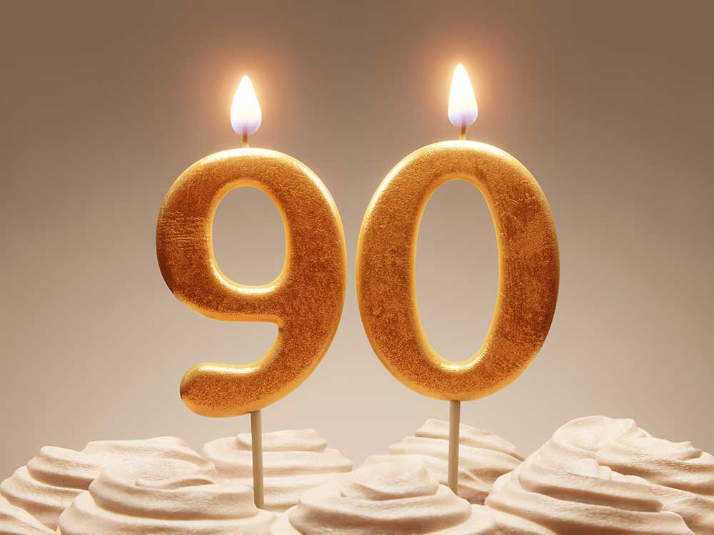 Lit 9-0 candles on cake