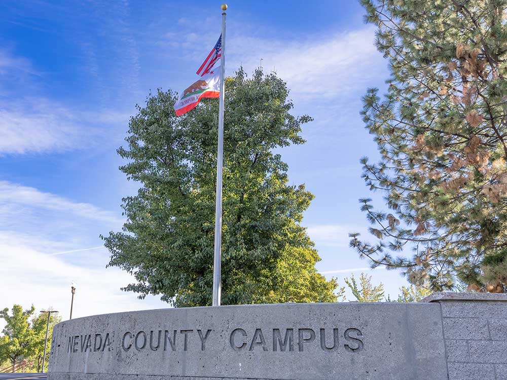 American Flag and California Flag at entrance of Nevada County Campus