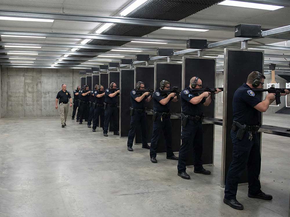 Police officers shapen their skills at rifle range training.
