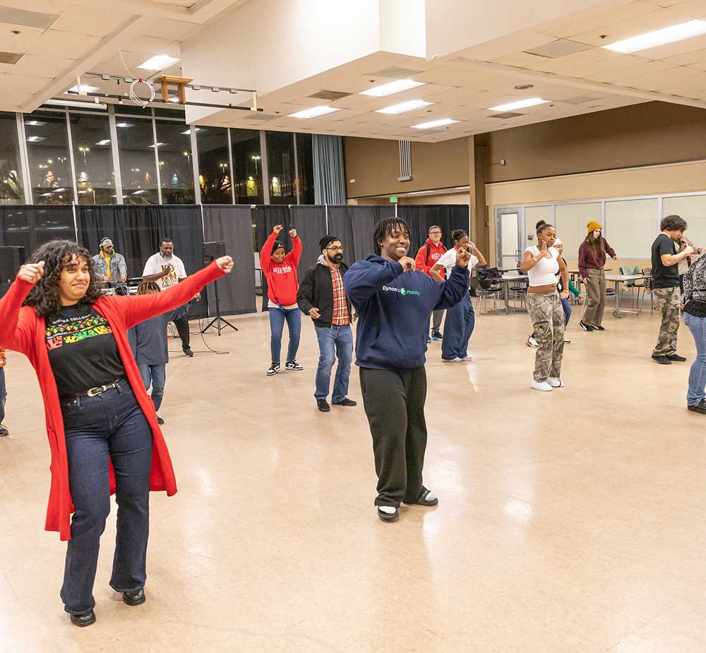 Students and staff learning a dance at 2026 Afro Fest